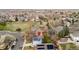 Overhead view of a residential community featuring solar panels, green spaces, and neighborhood streets at 11402 Benton Ct, Westminster, CO 80020