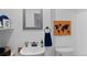 Charming powder room featuring stylish fixtures, decor, and a mirror at 11402 Benton Ct, Westminster, CO 80020