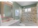 Stylish bathroom with a tub, a tile shower, and a vessel sink at 11402 Benton Ct, Westminster, CO 80020