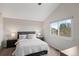 Comfortable bedroom with neutral tones, a large window, and ample natural light at 11402 Benton Ct, Westminster, CO 80020