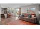 Inviting living room with warm wood floors, lots of light, and access to the patio at 11402 Benton Ct, Westminster, CO 80020