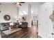 Bright living room featuring vaulted ceilings, hardwood floors, skylights, and comfortable seating area at 11402 Benton Ct, Westminster, CO 80020