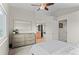 Spacious main bedroom showcasing a dresser and ensuite bathroom entrance at 11402 Benton Ct, Westminster, CO 80020