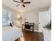 Comfortable bedroom with natural light, desk, and hardwood floors at 1171 Syracuse St, Denver, CO 80220