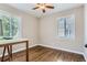 Bright bedroom featuring hardwood floors and natural light at 1171 Syracuse St, Denver, CO 80220