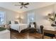 Cozy bedroom with ample natural light and hardwood floors at 1171 Syracuse St, Denver, CO 80220