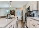 Stylish kitchen with modern appliances, grey backsplash, and bright countertops at 1171 Syracuse St, Denver, CO 80220
