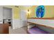 Bunk bed in the yellow bedroom features paneled walls and ample sunlight at 4194 S Kalispell St, Aurora, CO 80013