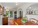 Open dining room with hardwood floors and a sliding glass door to the exterior at 4194 S Kalispell St, Aurora, CO 80013