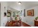 Bright dining room with hardwood floors, a window, sliding glass door and a wooden dining table at 4194 S Kalispell St, Aurora, CO 80013