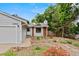 Charming home exterior featuring a well-maintained yard and front entry at 4194 S Kalispell St, Aurora, CO 80013