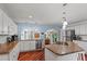 Beautiful kitchen featuring white cabinets, stainless steel appliances, and a spacious island at 4194 S Kalispell St, Aurora, CO 80013