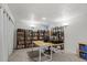 Home office featuring a large desk, shelving, and built-in lighting at 4194 S Kalispell St, Aurora, CO 80013