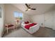 Bright bedroom featuring a ceiling fan, cozy carpet, and a window offering natural light at 5465 Zephyr St # 201, Arvada, CO 80002