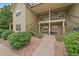 Multi-level condo building showcasing well-maintained landscaping and access stairs to upper units at 5465 Zephyr St # 201, Arvada, CO 80002