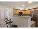Modern kitchen featuring stainless steel appliances, and bar seating at 5465 Zephyr St # 201, Arvada, CO 80002