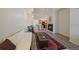 Inviting living room featuring a fireplace, wood-look flooring, and dining area at 5465 Zephyr St # 201, Arvada, CO 80002