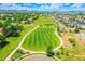 Scenic aerial view of a community park with walking paths, open fields, and playground areas at 428 Starline Ave, Lafayette, CO 80026