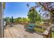 Enjoy outdoor living on this wood deck, with a table and chairs, and a grill for entertaining at 428 Starline Ave, Lafayette, CO 80026