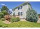 Back exterior view of the house showing the wood deck and landscaped backyard at 428 Starline Ave, Lafayette, CO 80026