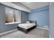 Blue bedroom with a single bed, window, and carpet at 428 Starline Ave, Lafayette, CO 80026