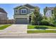 Charming two-story home showcasing a well-manicured lawn, inviting curb appeal, and a two-car attached garage at 428 Starline Ave, Lafayette, CO 80026