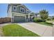 Charming two-story home showcasing a well-manicured lawn, inviting curb appeal, and a two-car attached garage at 428 Starline Ave, Lafayette, CO 80026