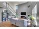 Inviting living room with a soaring ceiling, a cozy fireplace, and an abundance of natural light, creating a welcoming ambiance at 428 Starline Ave, Lafayette, CO 80026
