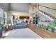 Open-concept living room showcases hardwood floors, staircase and an adjacent kitchen at 428 Starline Ave, Lafayette, CO 80026
