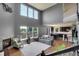 Spacious living room with high ceilings, large windows, fireplace, and open floor plan to the kitchen at 428 Starline Ave, Lafayette, CO 80026