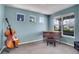 Cozy living room with natural light, a piano and cello, offering an inviting space for relaxation or musical pursuits at 428 Starline Ave, Lafayette, CO 80026