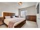 Beautifully decorated main bedroom with a large bed, wood furniture, and a cozy feel at 428 Starline Ave, Lafayette, CO 80026