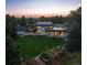 Expansive property with manicured lawn, solar panels, and tranquil wooded surroundings at 17326 W 57Th Ave, Golden, CO 80403