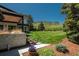 Expansive backyard with lush lawn, beautiful landscaping, and picturesque mountain views at 17326 W 57Th Ave, Golden, CO 80403