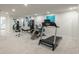 Basement gym featuring mirrored wall, weight training equipment and a treadmill at 17326 W 57Th Ave, Golden, CO 80403
