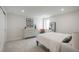 Cozy bedroom with neutral paint, carpet, dresser, mirror and minimalist decor at 17326 W 57Th Ave, Golden, CO 80403