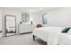 Comfortable bedroom with natural light, neutral tones, and a full length mirror at 17326 W 57Th Ave, Golden, CO 80403