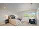Inviting bedroom with a comfortable bed, side tables, and scenic outdoor views at 17326 W 57Th Ave, Golden, CO 80403