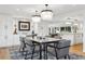 Bright dining area with modern pendant lighting, adjacent to the kitchen and living spaces at 17326 W 57Th Ave, Golden, CO 80403