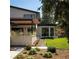 Beautifully landscaped exterior with a modern pergola, stone accents, and lush greenery at 17326 W 57Th Ave, Golden, CO 80403
