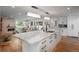 Bright kitchen with quartz countertops, stainless steel appliances, and hardwood flooring at 17326 W 57Th Ave, Golden, CO 80403