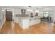 Bright kitchen with quartz countertops, stainless steel appliances, and hardwood flooring at 17326 W 57Th Ave, Golden, CO 80403