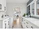 Well-lit laundry room with modern appliances, ample counter space, and stylish cabinetry at 17326 W 57Th Ave, Golden, CO 80403