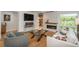 Stylish living room featuring a modern fireplace, hardwood floors, comfortable seating, and ample natural light at 17326 W 57Th Ave, Golden, CO 80403