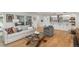 Bright living room featuring hardwood floors, a comfortable sofa, and modern decor at 17326 W 57Th Ave, Golden, CO 80403