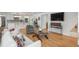 Bright living room featuring hardwood floors, a comfortable sofa, and modern decor at 17326 W 57Th Ave, Golden, CO 80403