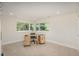 Minimalist office space with hardwood desk, chair, and picturesque windows at 17326 W 57Th Ave, Golden, CO 80403