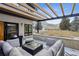 Outdoor patio featuring comfortable seating, a fire pit, and a scenic mountain view at 17326 W 57Th Ave, Golden, CO 80403