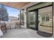 Outdoor patio with stone accents and seating offers seamless indoor-outdoor living at 17326 W 57Th Ave, Golden, CO 80403
