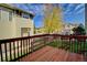 A view from the back deck features a shared yard and additional residences at 13033 Grant E Cir # B, Thornton, CO 80241